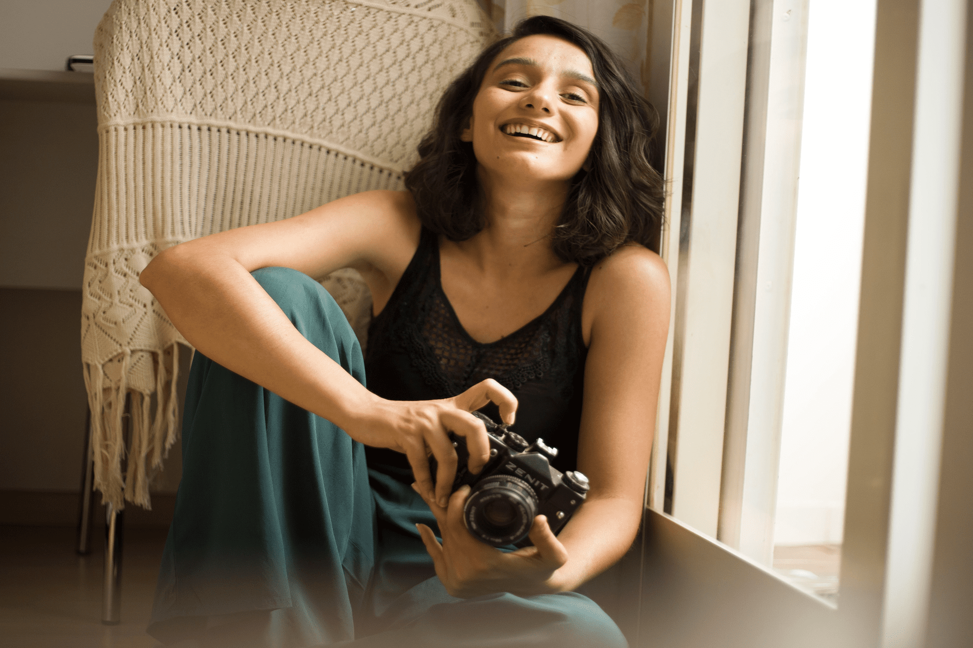 happy woman posing with camera as a mid-tier influencer