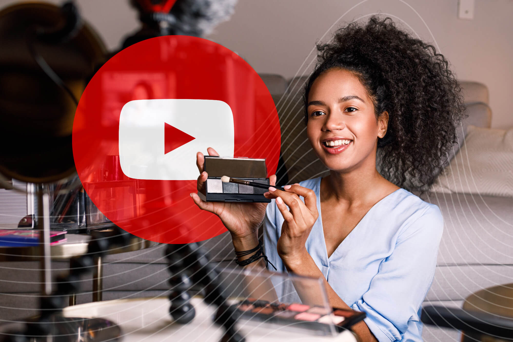 A woman holds a product in front of a camera on a tripod