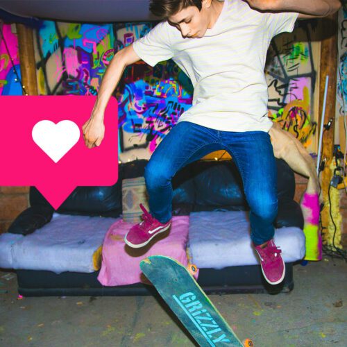 Teen boy does tricks on skateboard in trippy basement