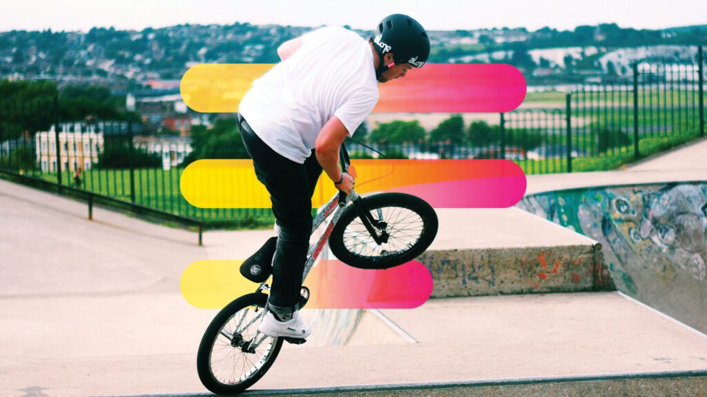 Man does BMX bike tricks