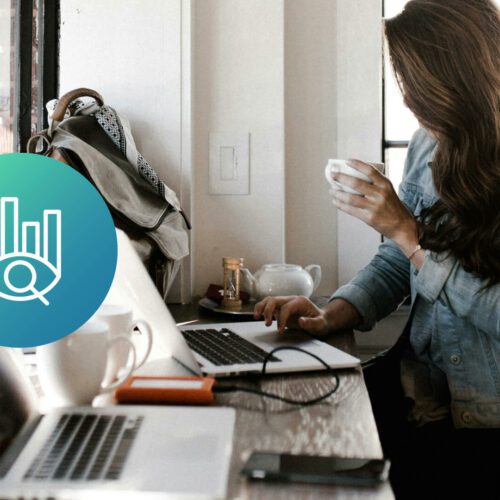 A marketer types at her laptop