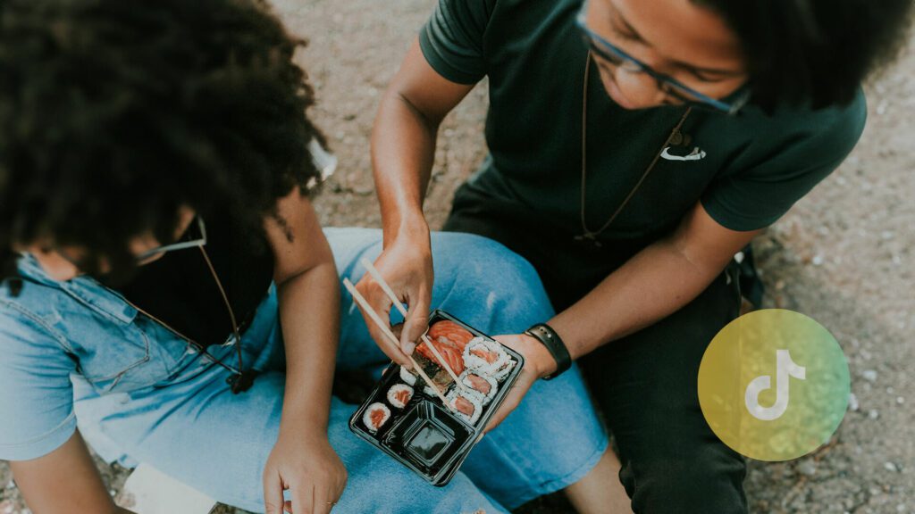 Two people eat sushi