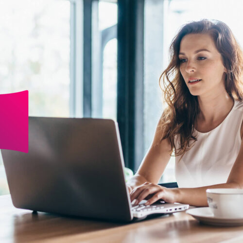 A woman works on a laptop