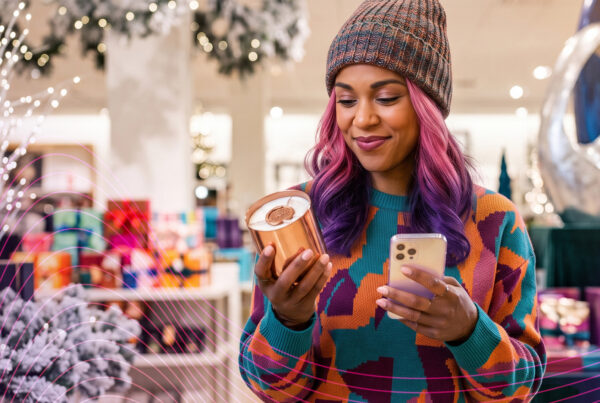 IZEA - Holiday influencer marketing strategy - Woman Holiday Shopping phone in hand
