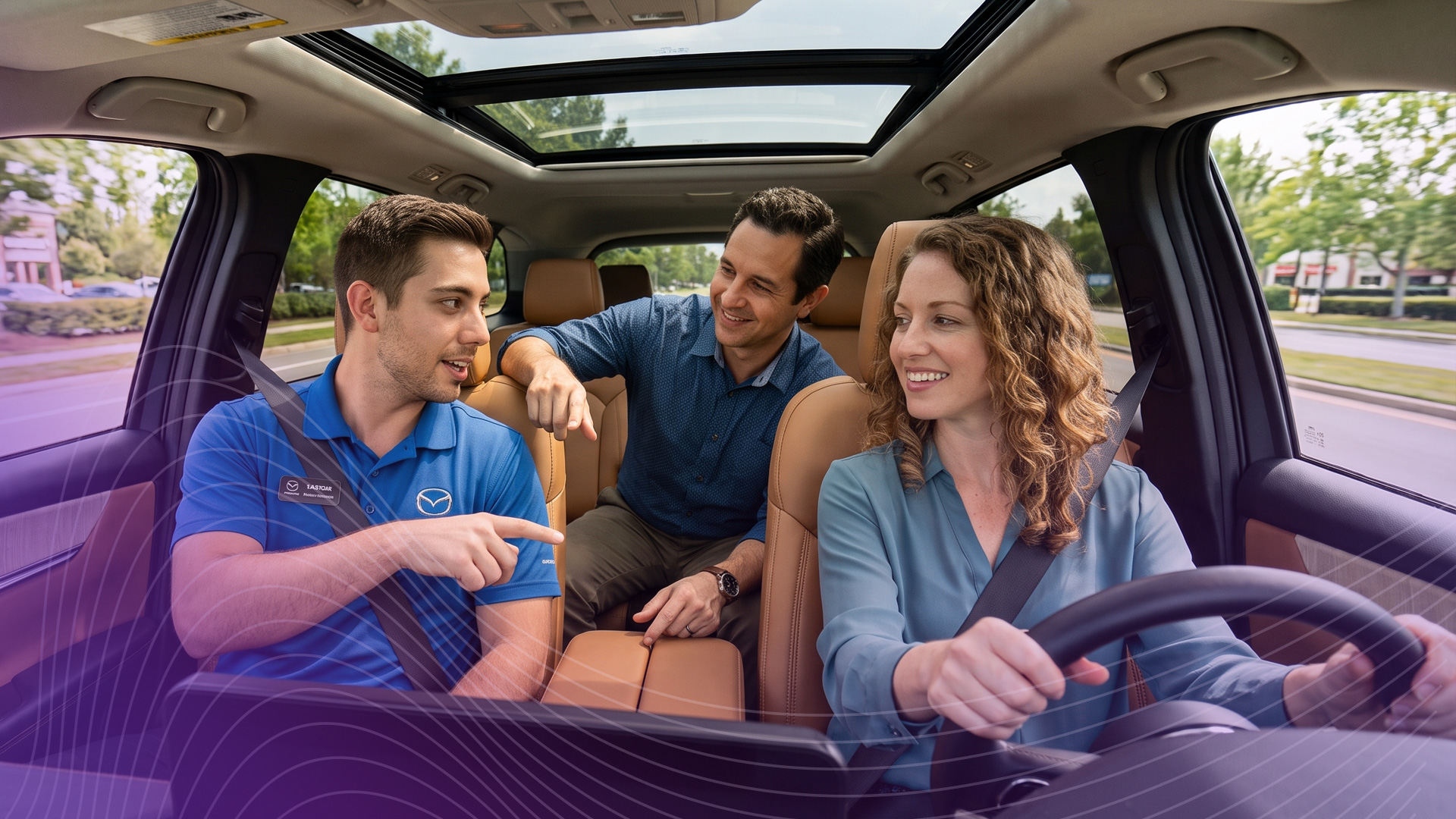 Couple going on a test drive with a Mazda sales person