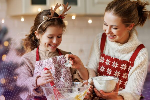 mother and daughter making holiday baked goods